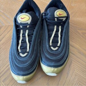 Nike Men's Black and Gold Sneakers with Red Accents